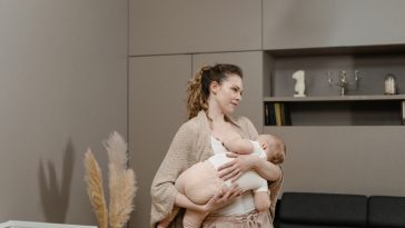 Photo of a Beautiful Mother Breastfeeding Her Baby