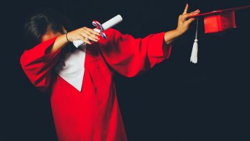 person wearing red graduation dress