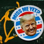 man in white and blue hat