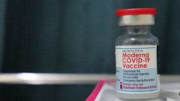 white and red labeled bottle