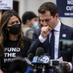 Councilmember Mamdani Caught Coughing Next to Masked Activist