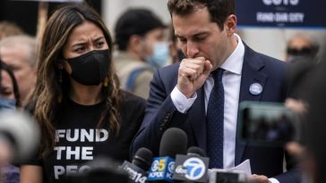 Councilmember Mamdani Caught Coughing Next to Masked Activist