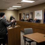 Masked Speaker Tells Mayor Kaohly Her to Abolish Private Property