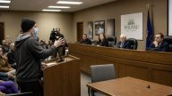 Masked Speaker Tells Mayor Kaohly Her to Abolish Private Property