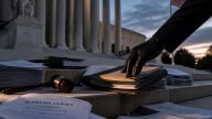 Trump asks Supreme Court to revive Clinton Russia suit, wipe sanctions
